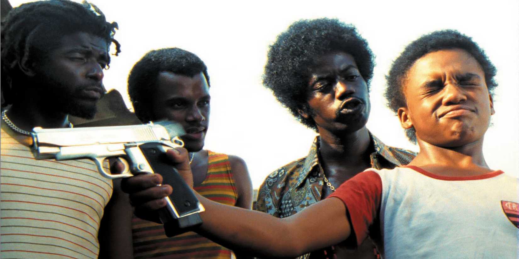 The characters in City of God with one boy holding a gun