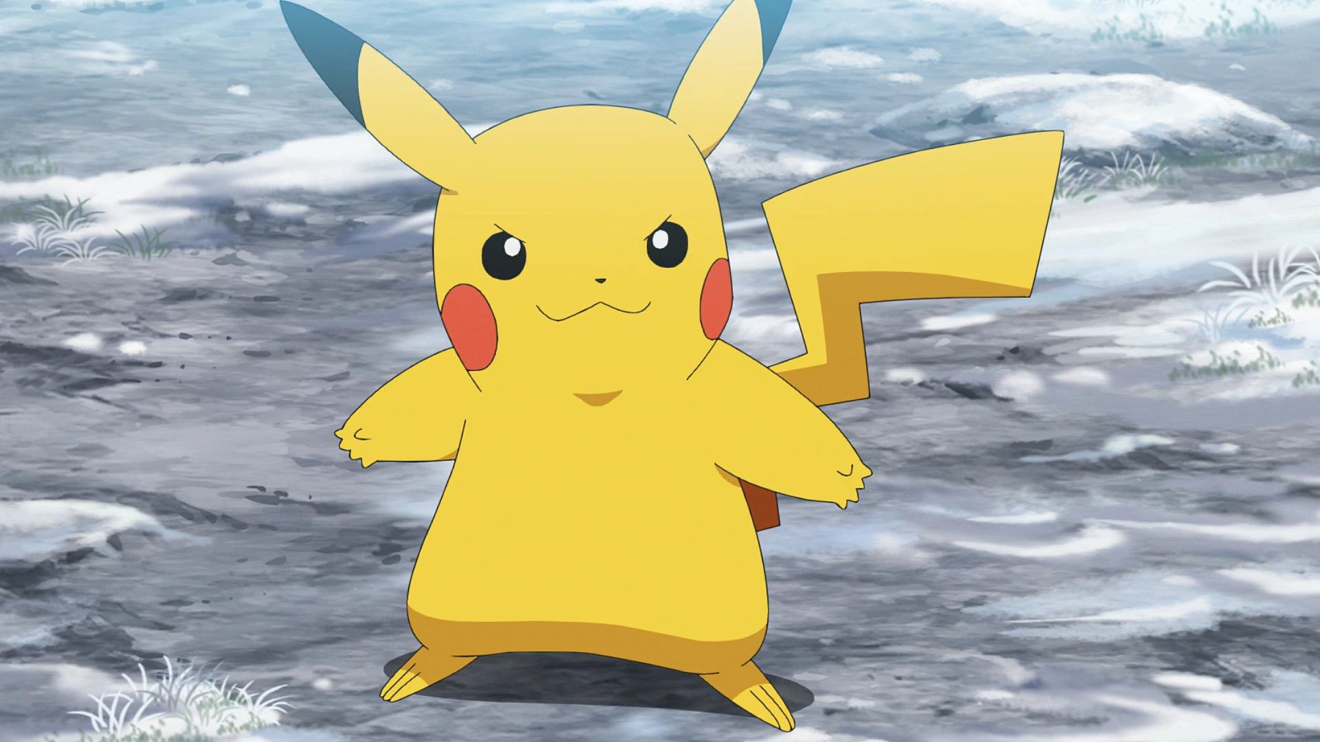 An image of Pikachu the Pokemon standing on a rocky area is a fighting stance.