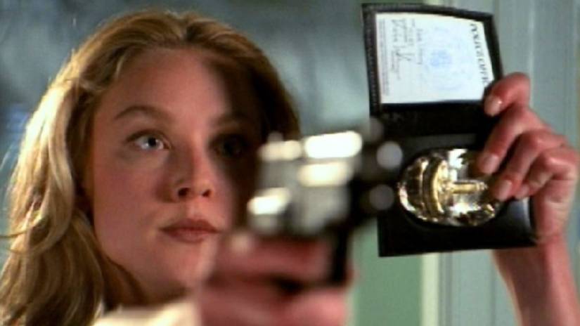 Kate Lockley shows off her police badge in Angel