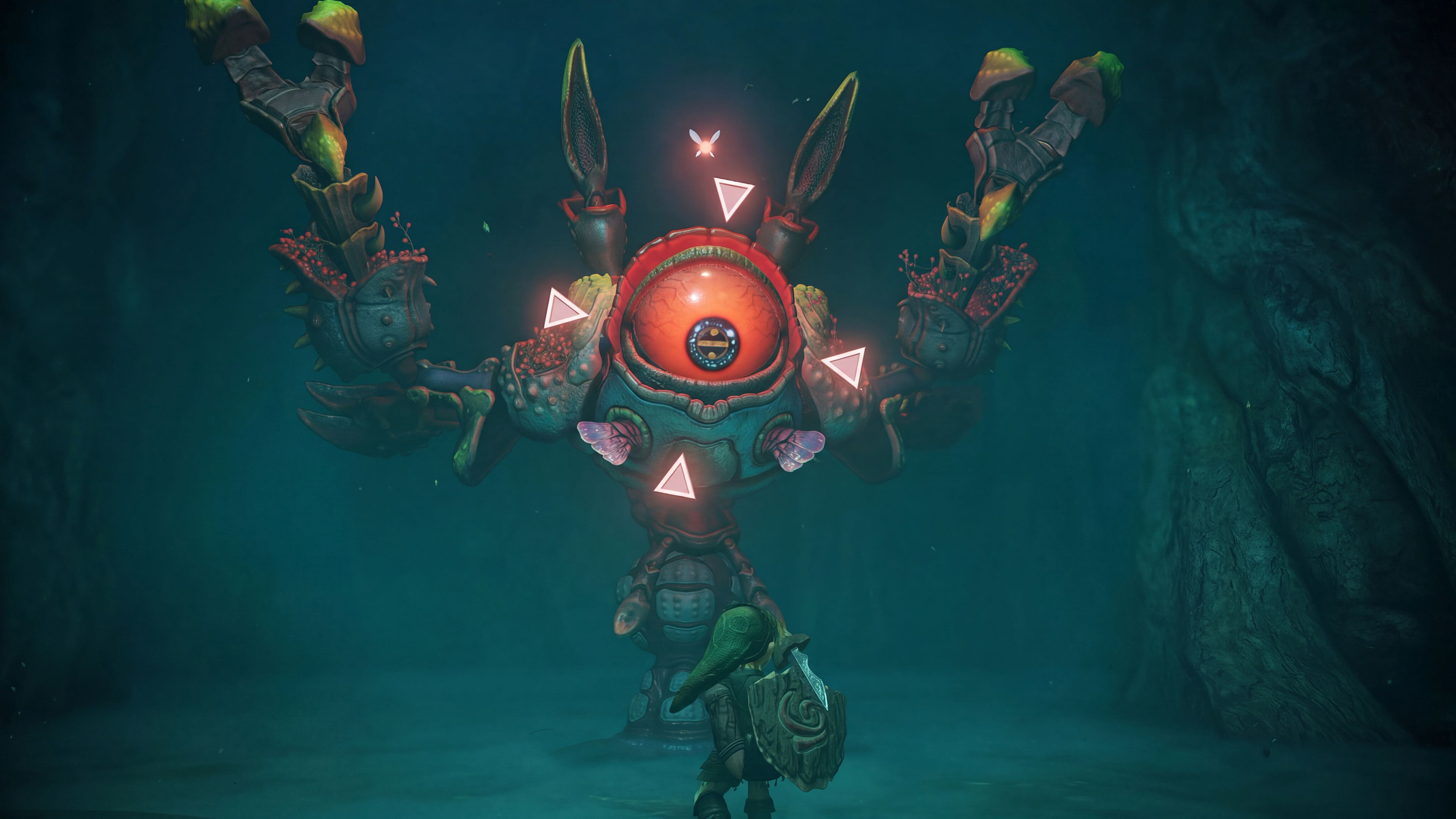 Link fighting Queen Gohma in the Great Deku Tree dungeon in the Zelda Ocarina of Time remake on Switch 2