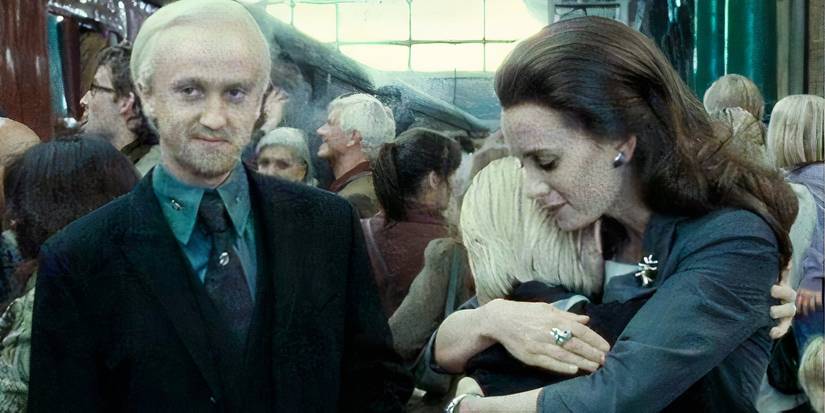 A still of Draco Malfoy and his wife Astoria sending their child to Hogwarts in Harry Potter