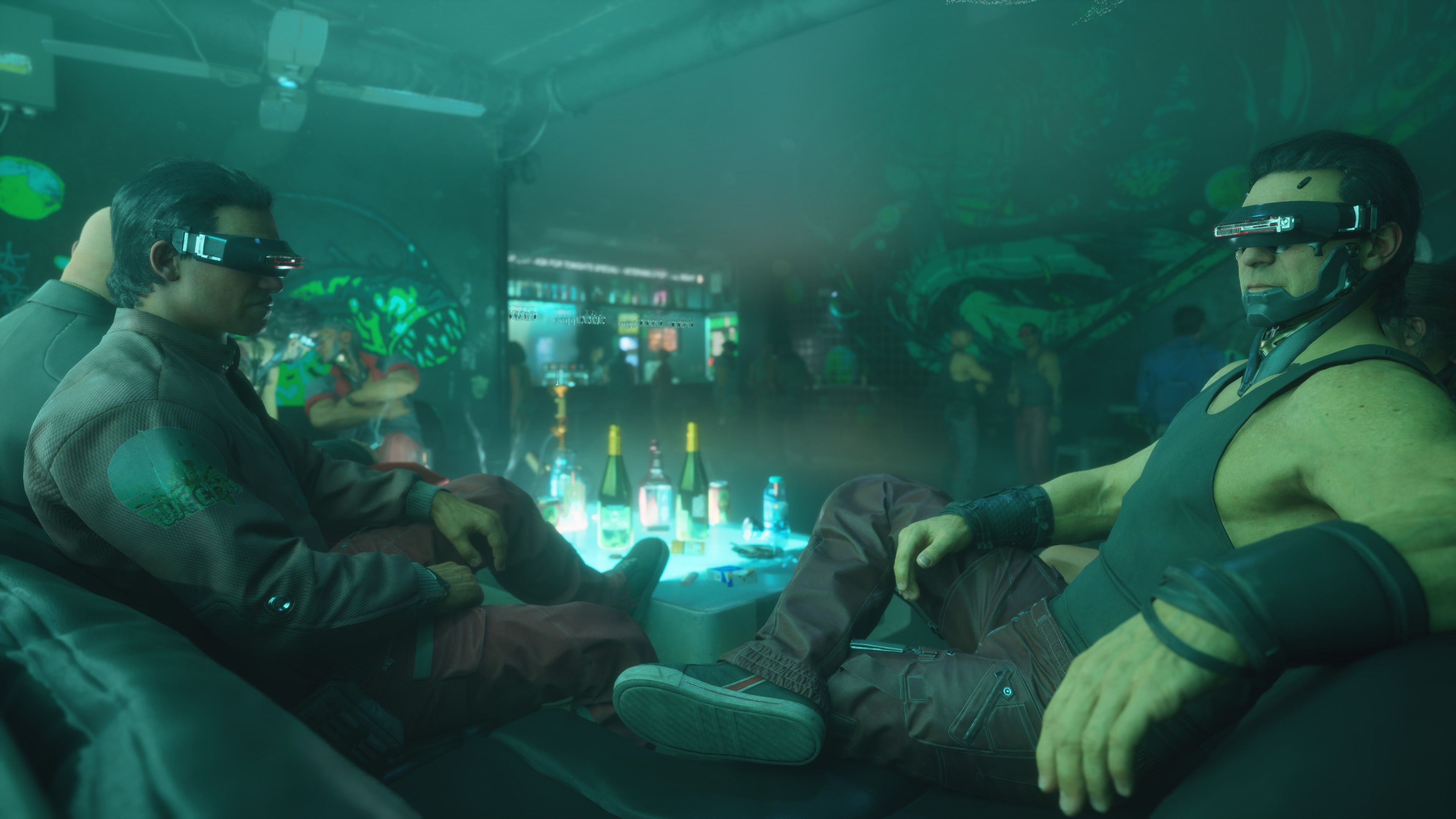Men sitting at table with VR glasses