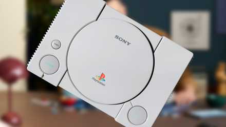 A diagonally positioned PlayStaion 1 console in front of a blurred image of its LEGO counterpart.