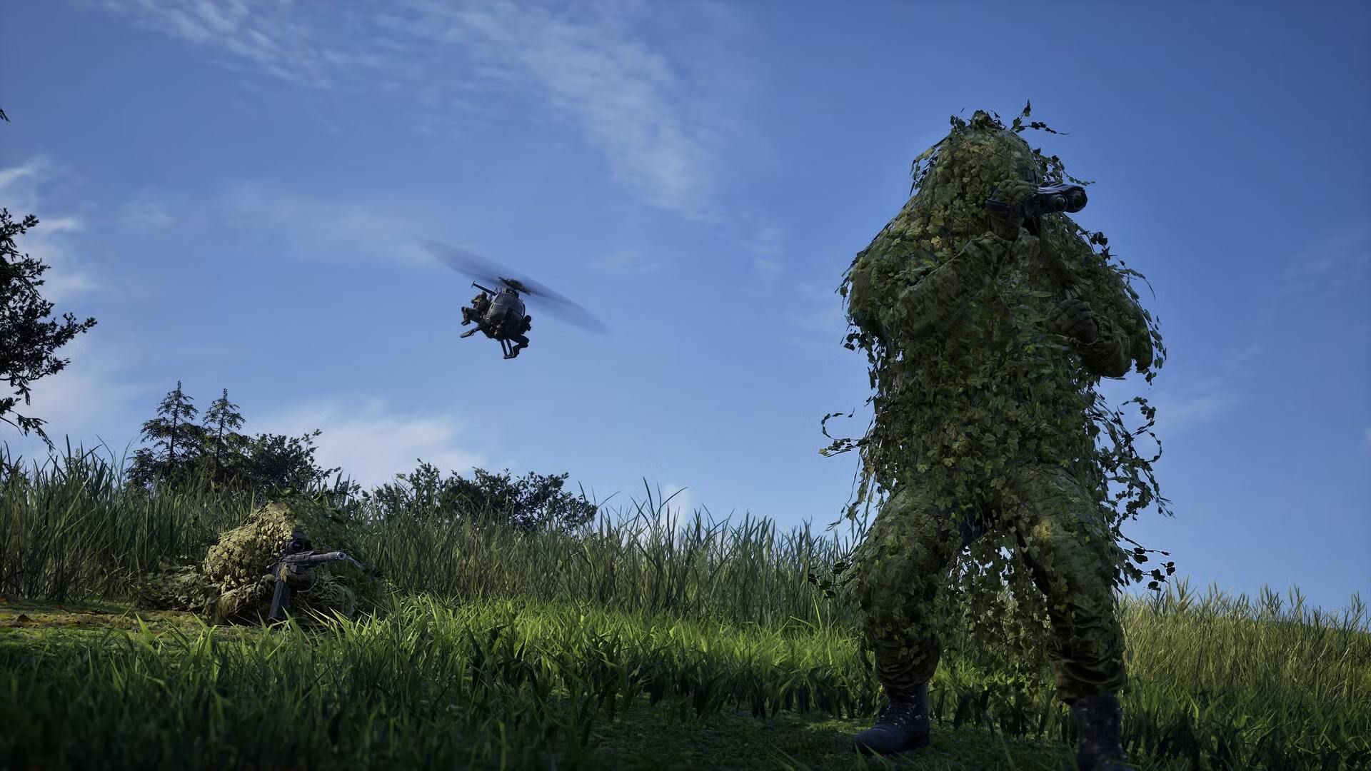 wardogs two soldiers in ghillie suits watching a helicopter fly over
