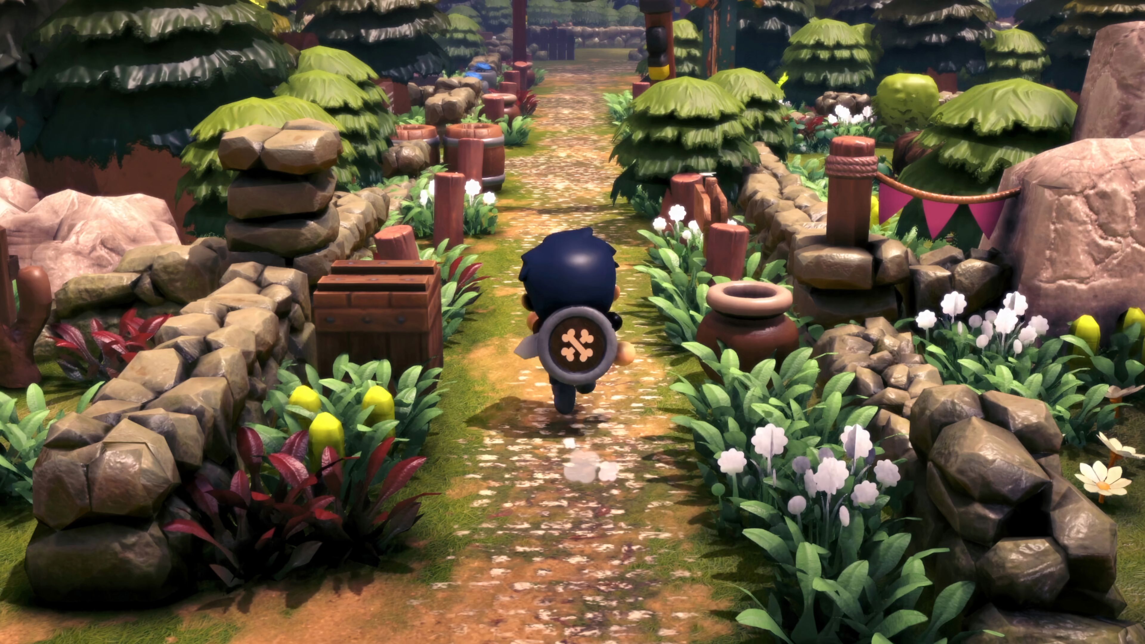 A character carrying a shield runs along a forest path in Littlelands