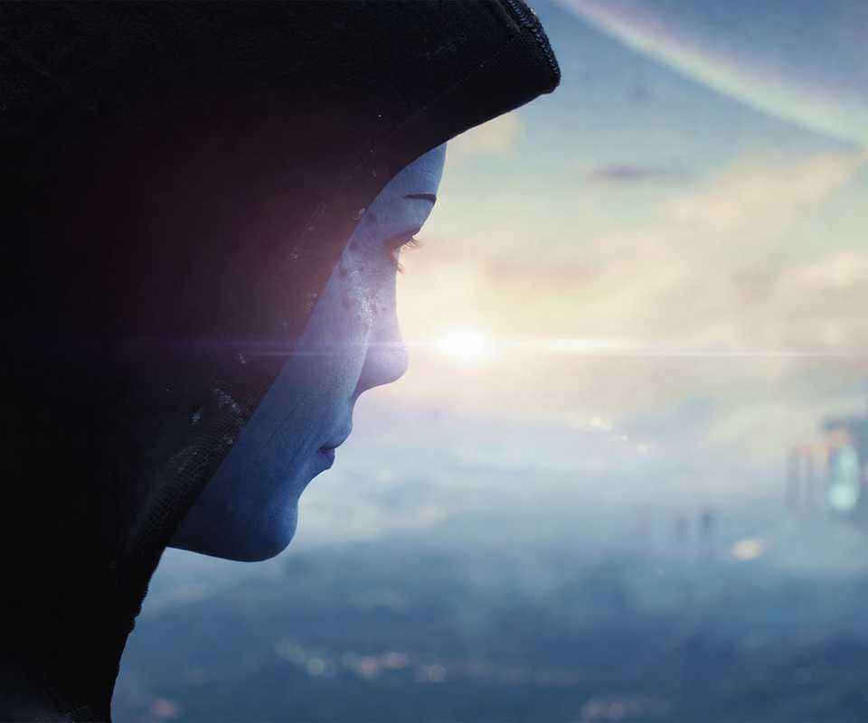 A close-up of Liara T'Soni wearing a dark hood and gazing toward the horizon in the Mass Effect teaser trailer