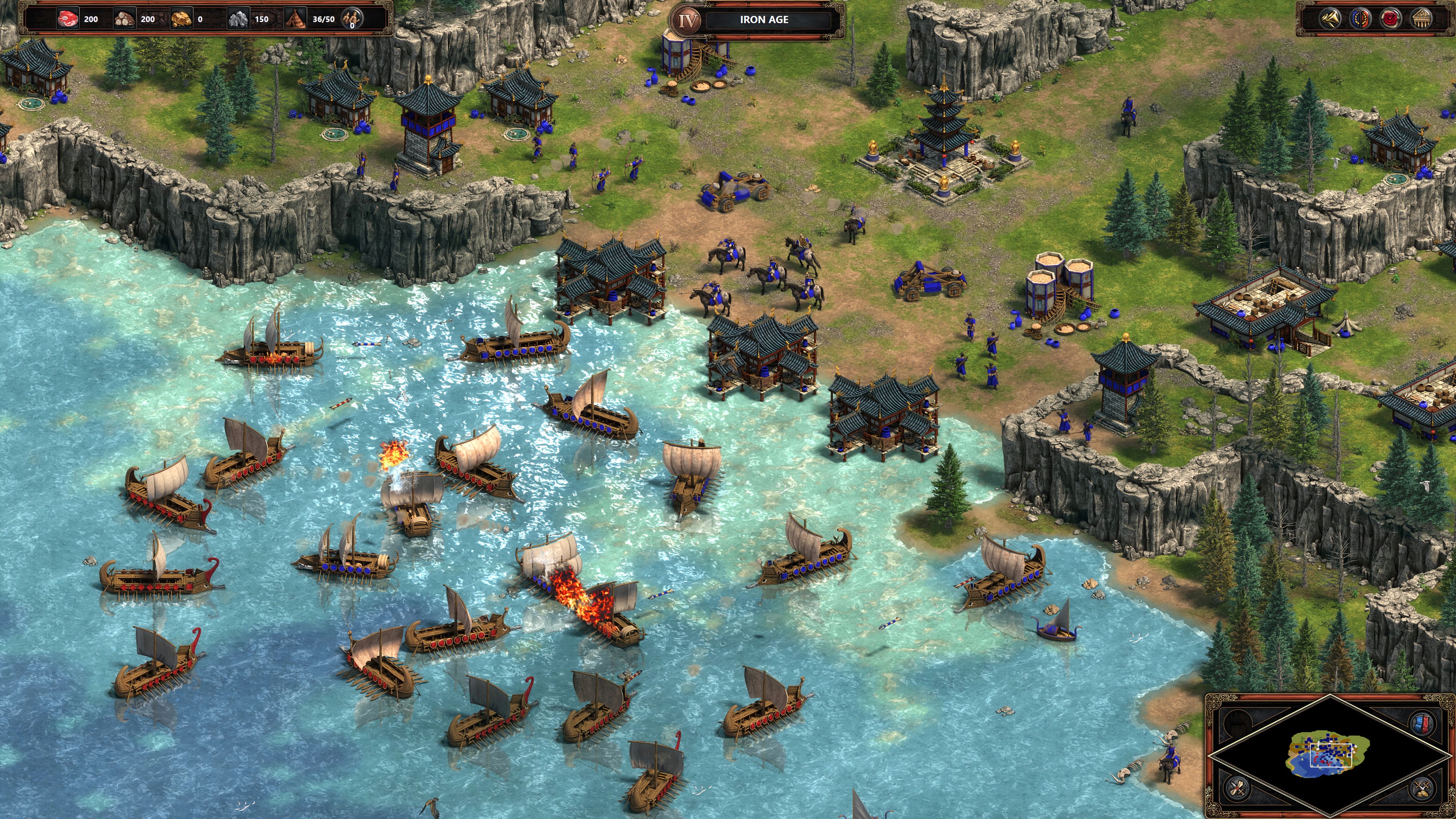 Rival fleets engage in a naval battle off the coast of an Asian settlement in Age of Empires Definitive Edition (1)