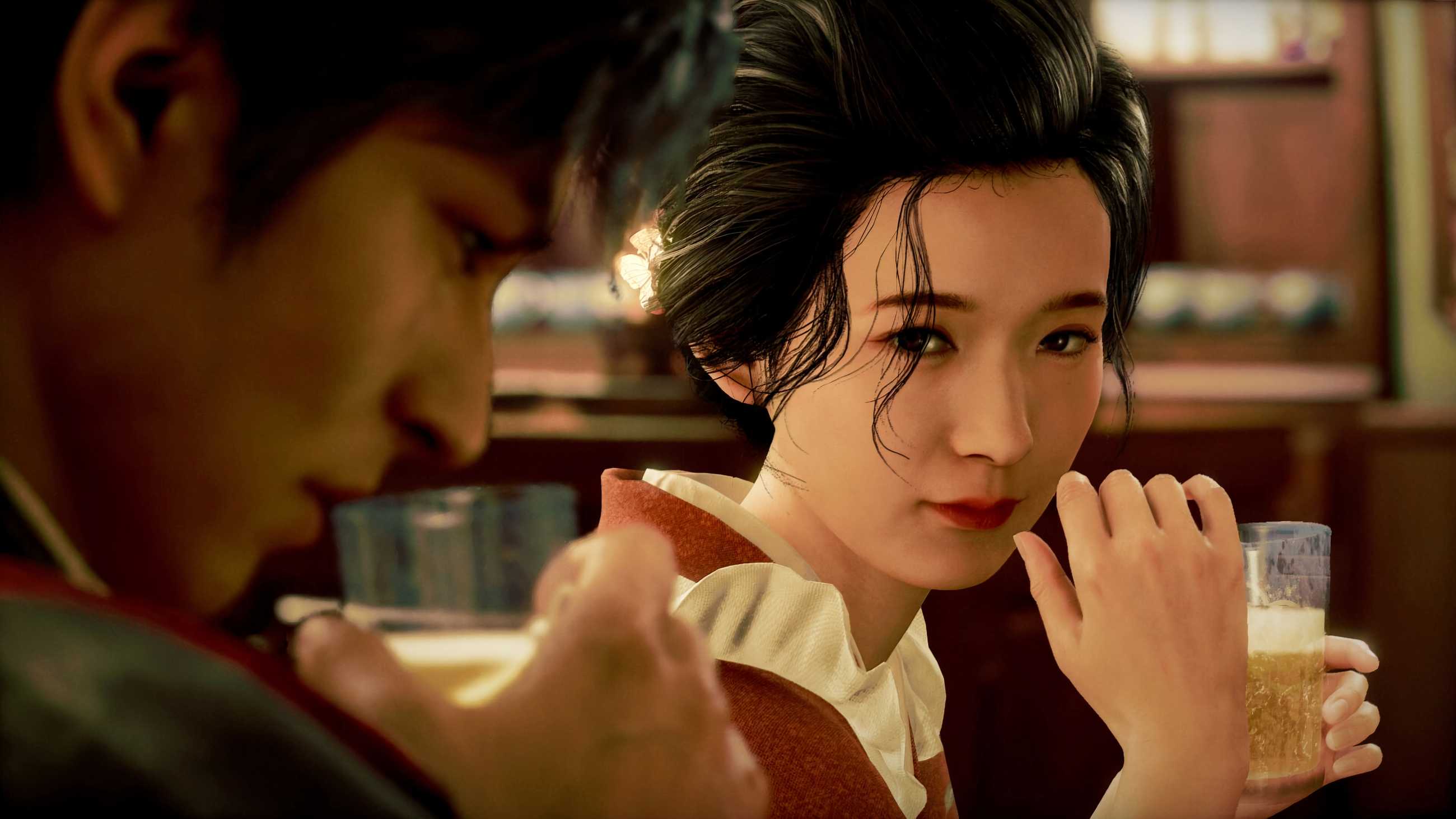 Tae Matsumoto holds a drink and looks toward Makoto Daito sitting beside her in a warmly lit bar in Stranger Than Heaven
