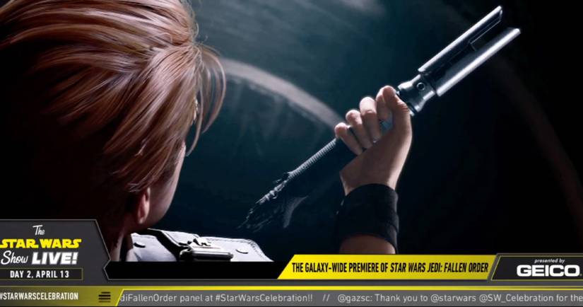 Cal holding lightsaber