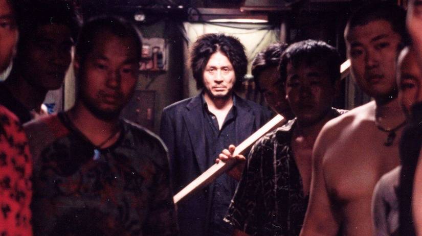 Oh Dae-su looking directly at the camera in Oldboy