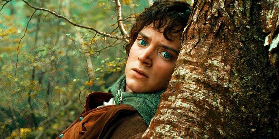 elijah-wood-hides-behind-a-tree-as-frodo-in-the-lord-of-the-rings-the-fellowship-of-the-ring.jpg