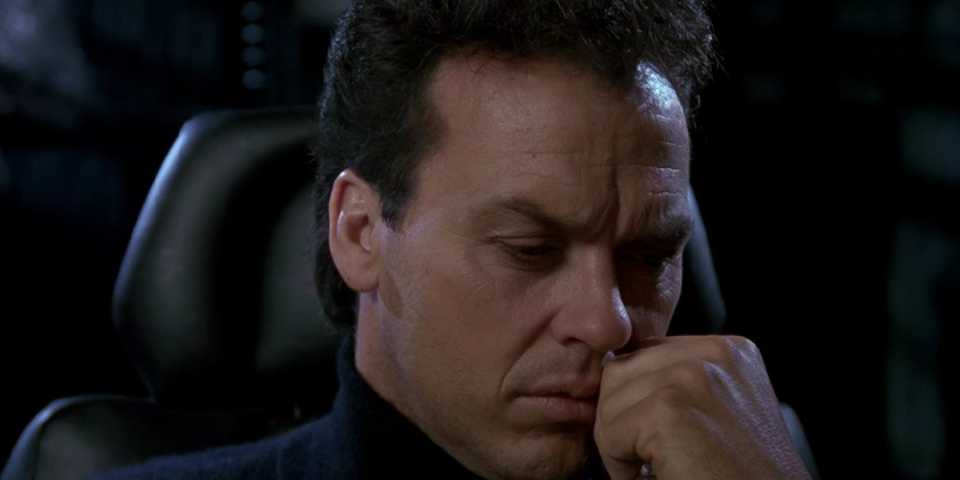 michael-keaton-as-bruce-wayne-looking-concerned-while-working-in-the-batcave-in-batman-1989.jpg