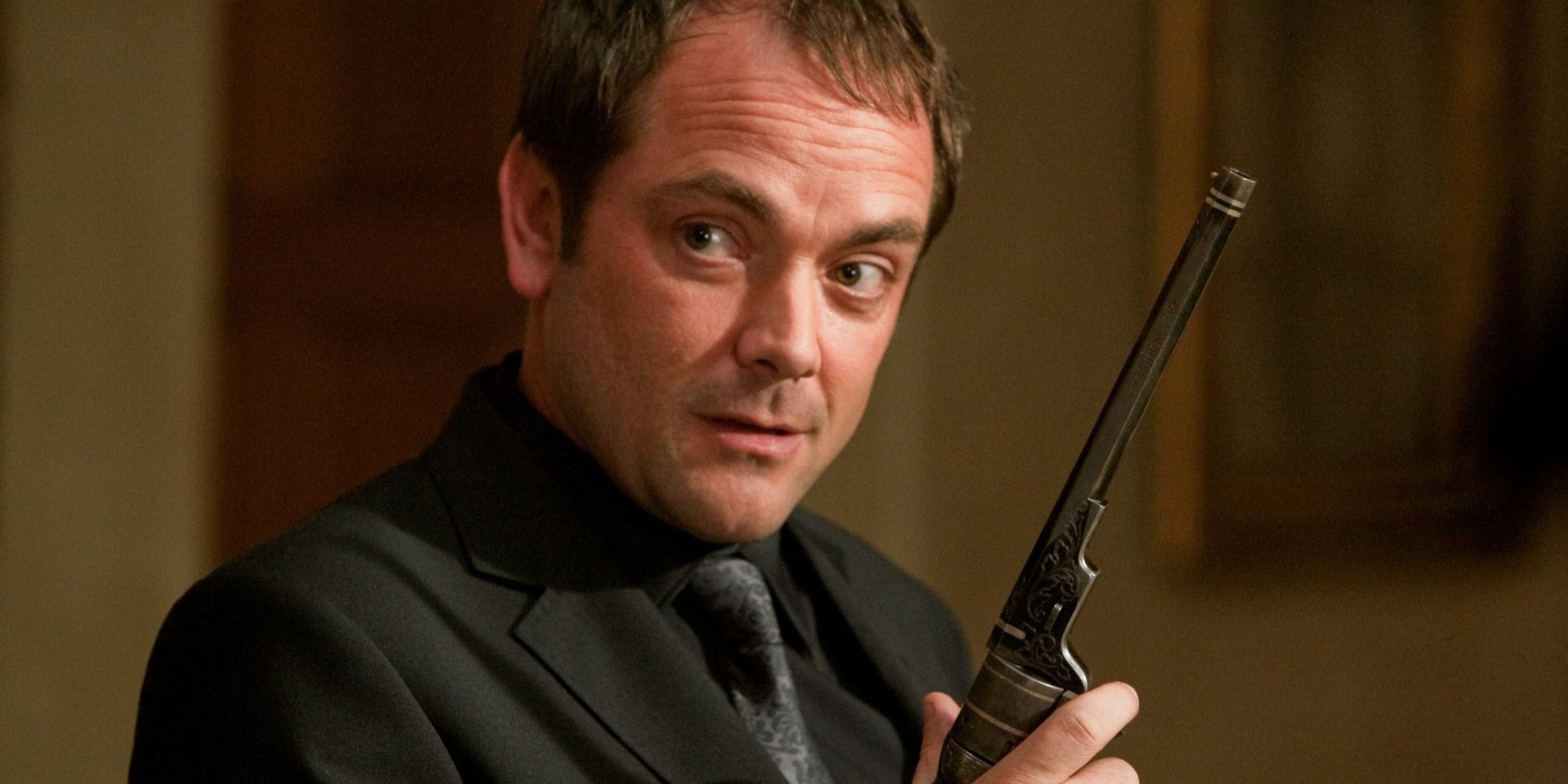 mark-sheppard-as-crowley-wielding-an-ancient-looking-pistol-in-supernatural.jpg