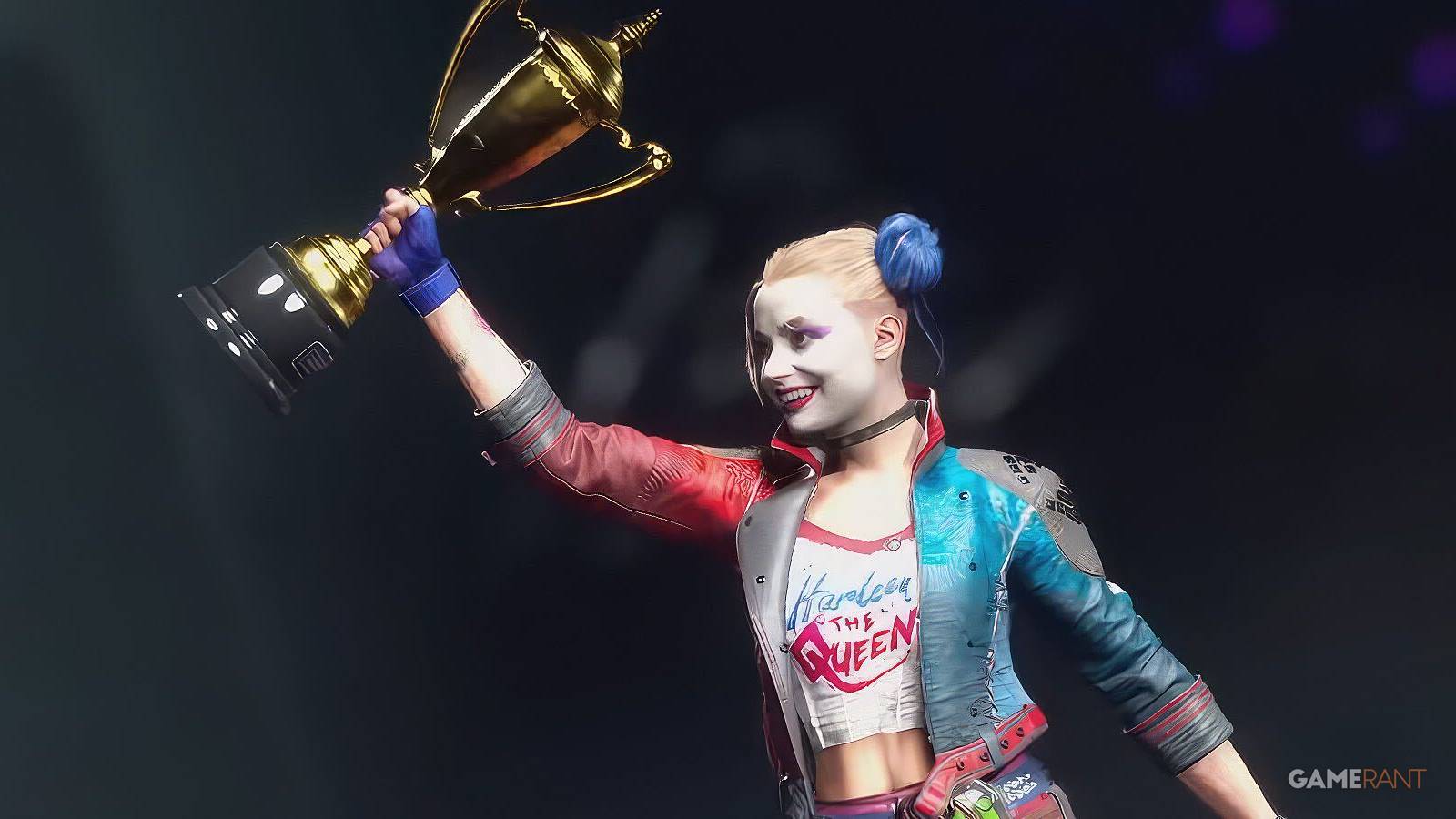 harley quinn proudly holding a gold trophy