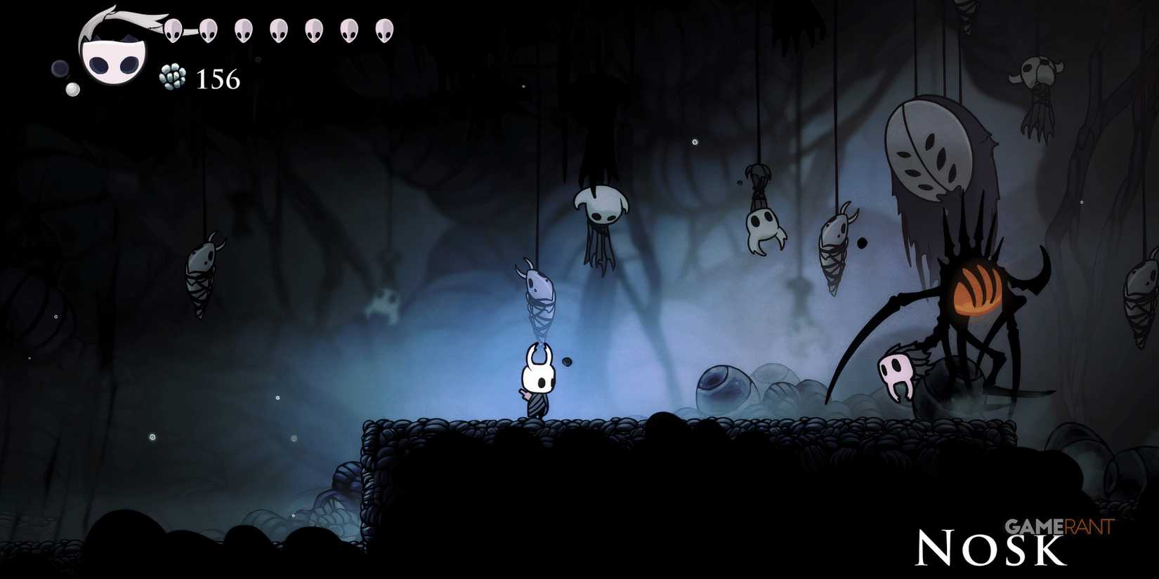 Hollow Knight: 13 Hardest Bosses, Ranked The Knight is attacked by Nosk with prey hanging from the ceiling behind
