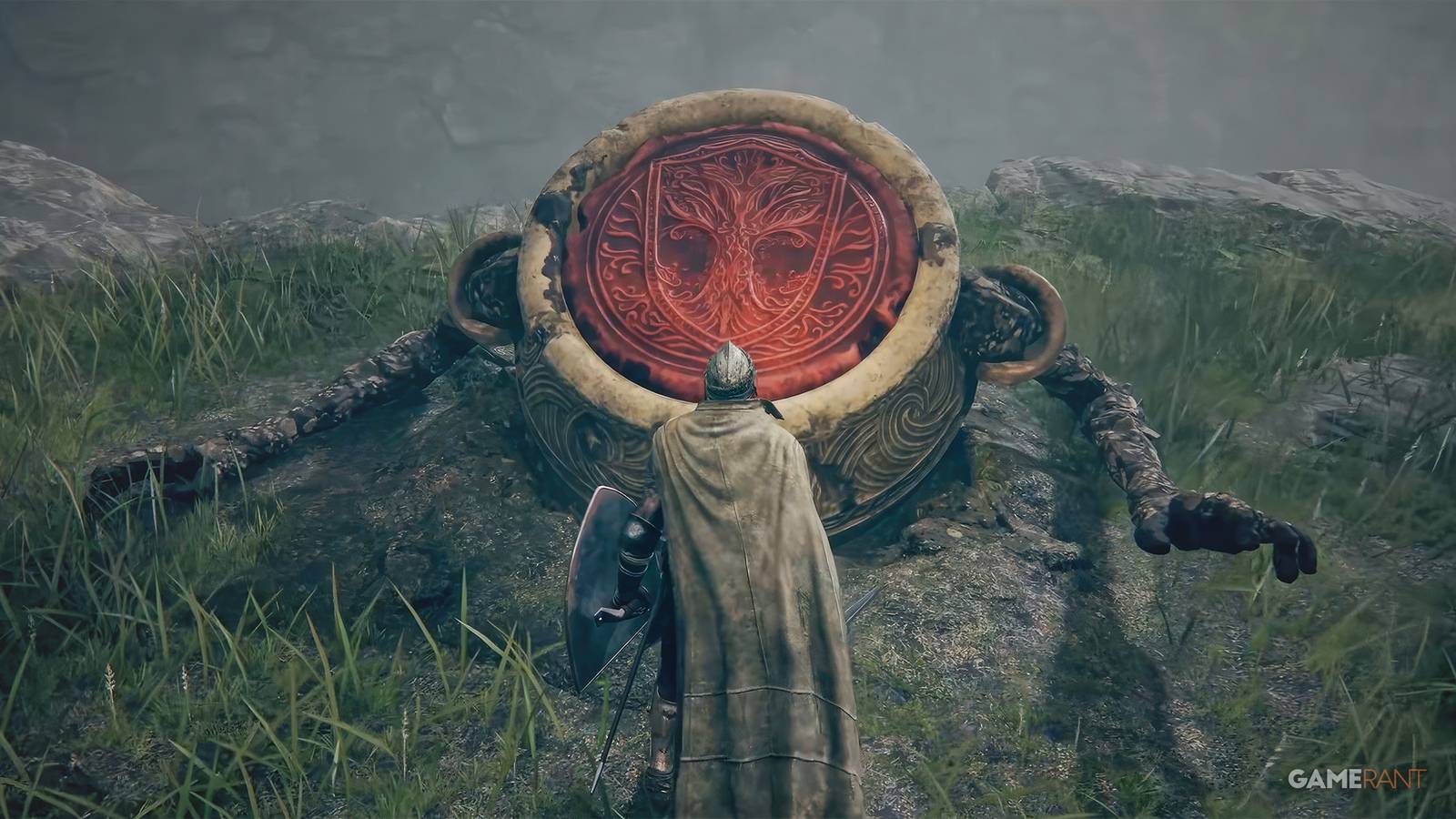 Elden Ring Iron Fist Alexander Warrior Jar stuck in ground in front of Vagabond Tarnished screenshot