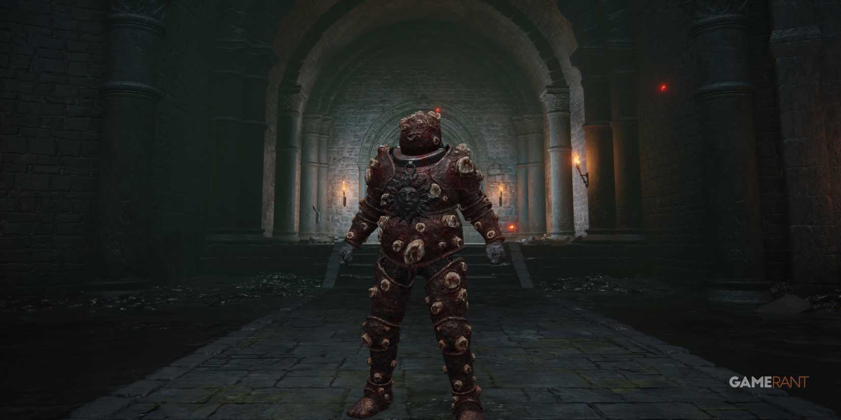 Elden Ring: 10 Best Armor For Poise Builds standing in a dark room wearing the Omen armour set