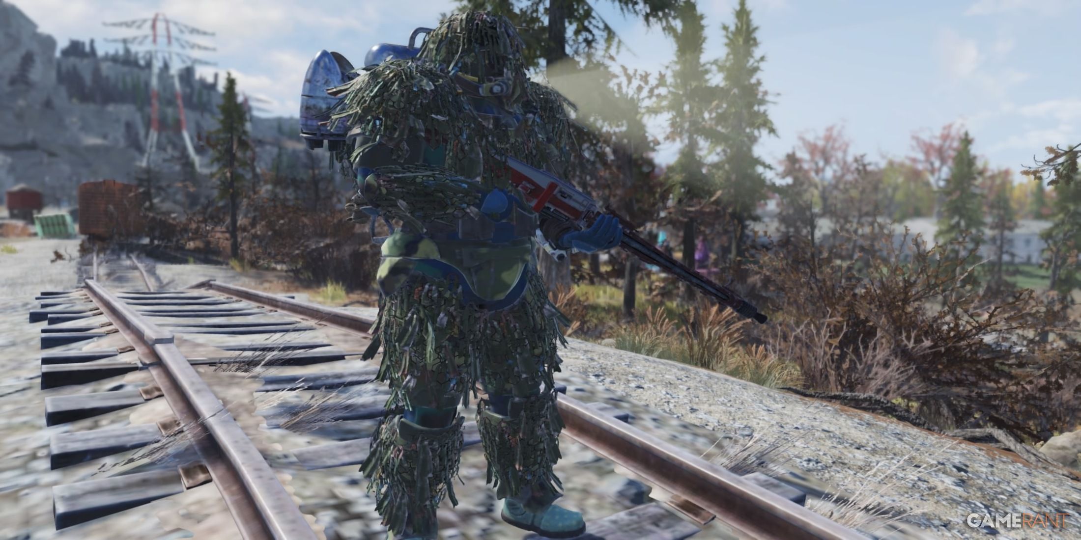 Player Wearing Camo Suit Holding The Red Terror in Fallout 76