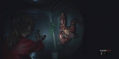 10 Most Disturbing Body Horror Enemies in Gaming Claire Redfield aiming at a Licker on the wall
