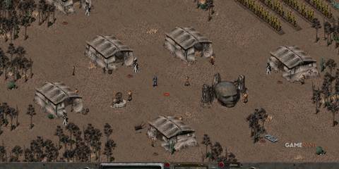 Player in a desert village with huts and NPCs in Fallout 2