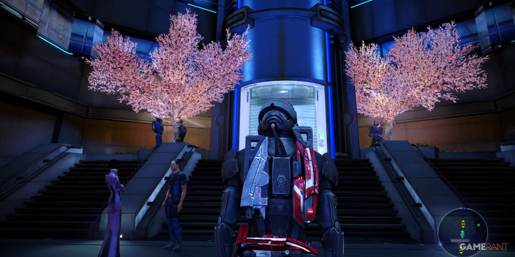 Shepard in front of two pink trees inside The Citadel in Mass Effect 1