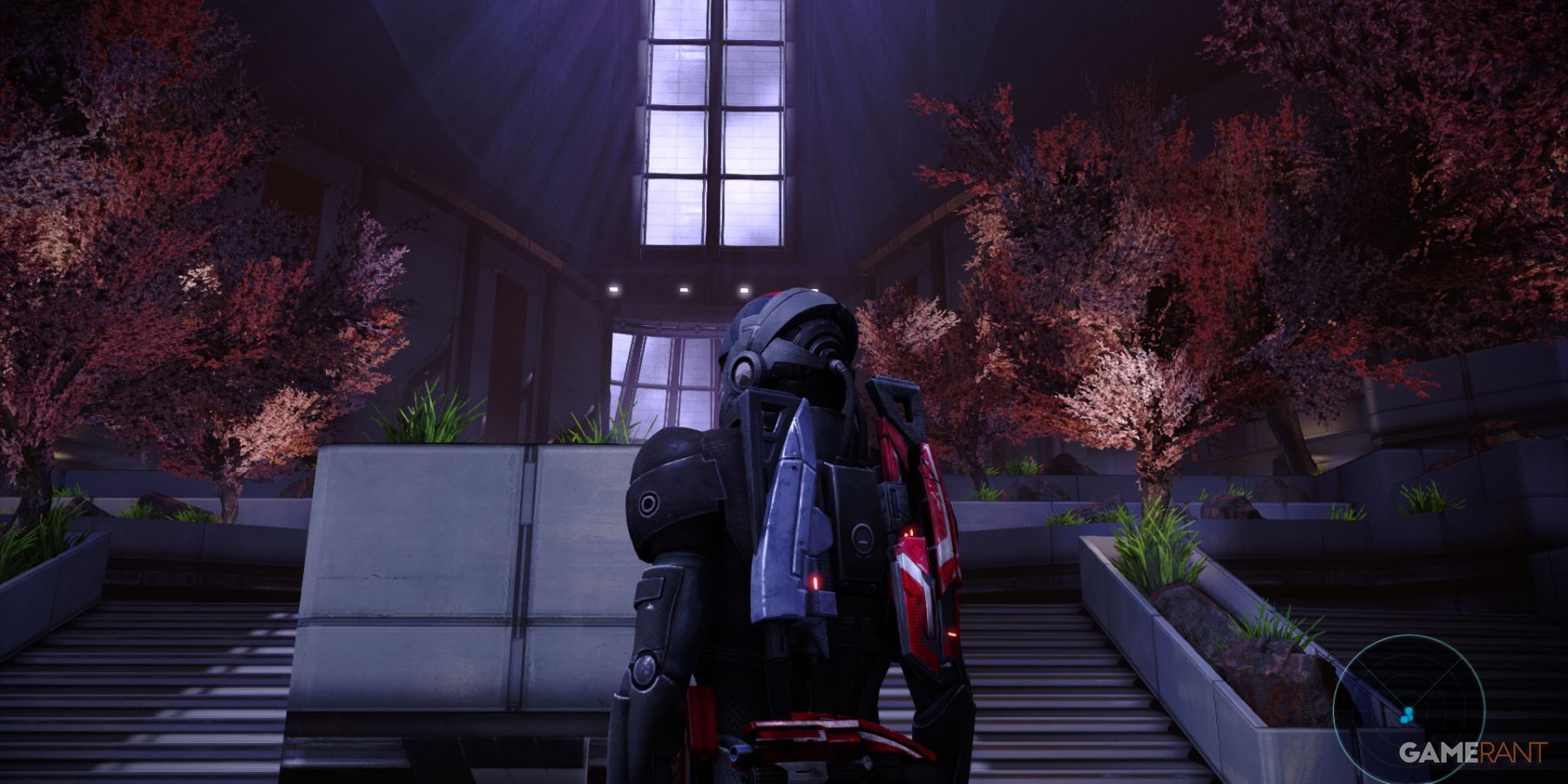 Shepard standing before steps with vibrant pink trees in The Citadel in Mass Effect 1