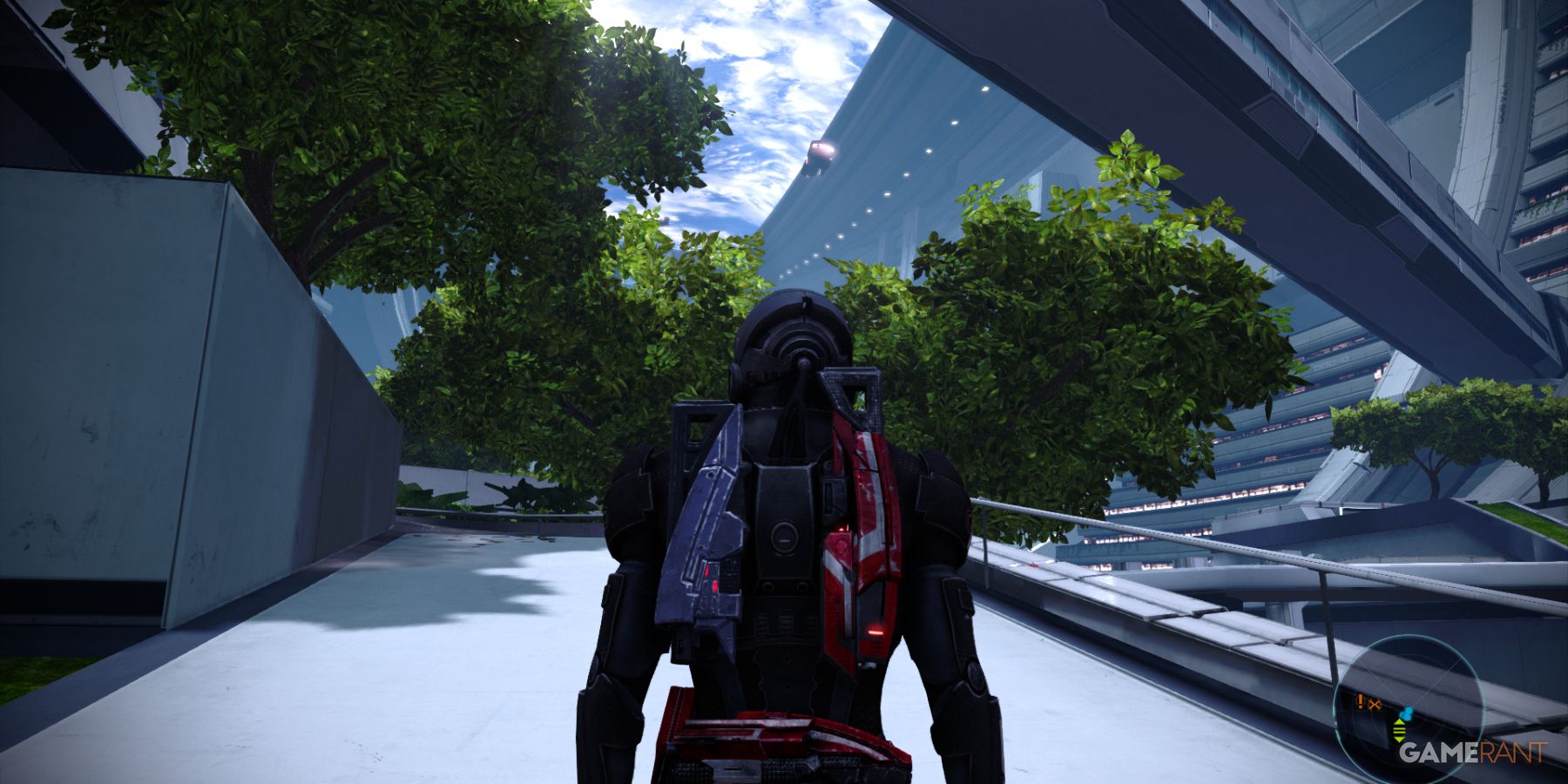 Shepard walking through a green, futuristic area in The Citadel in Mass Effect 1