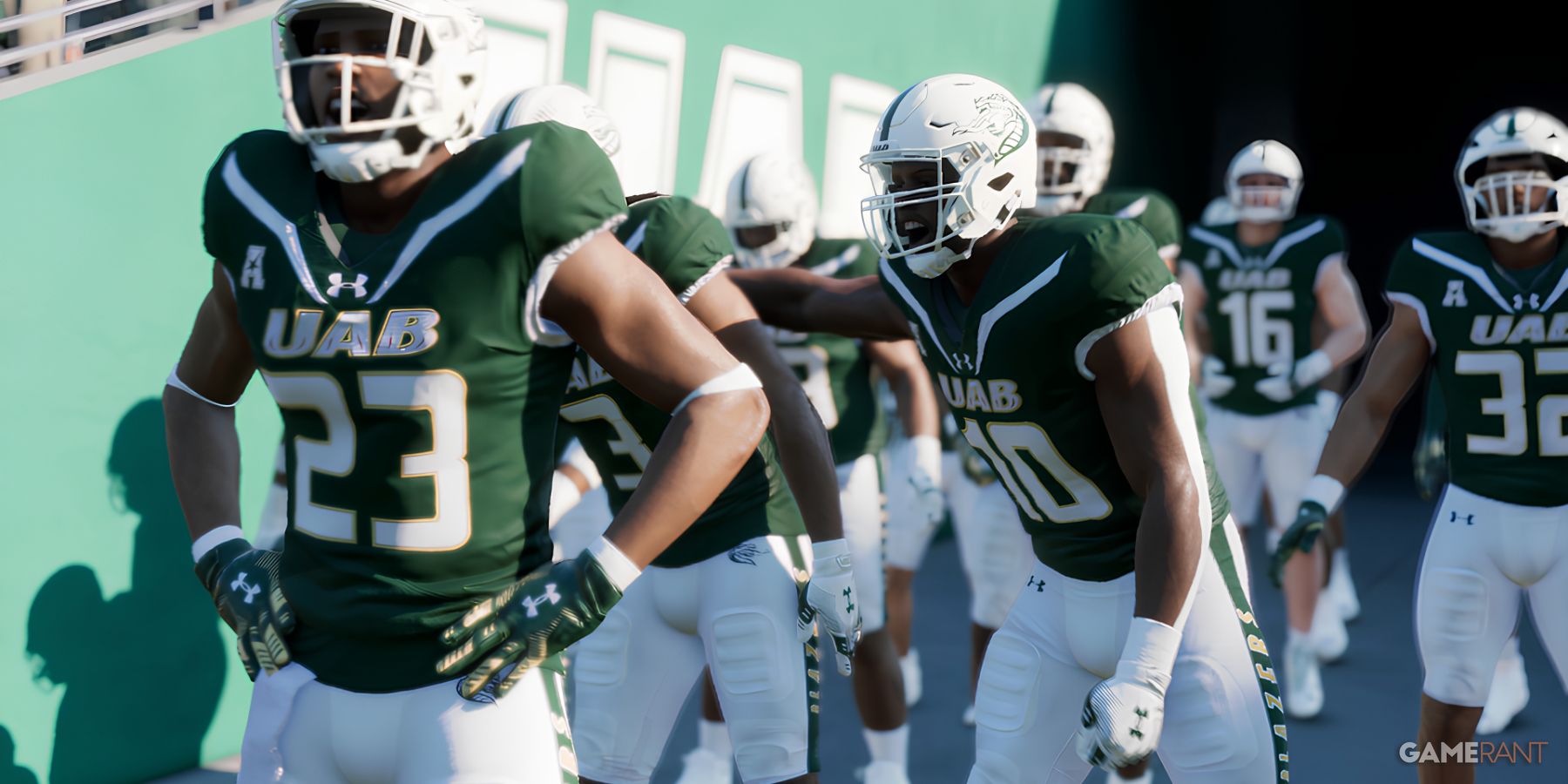 UAB players in green uniforms huddle before a game in College Football 25.