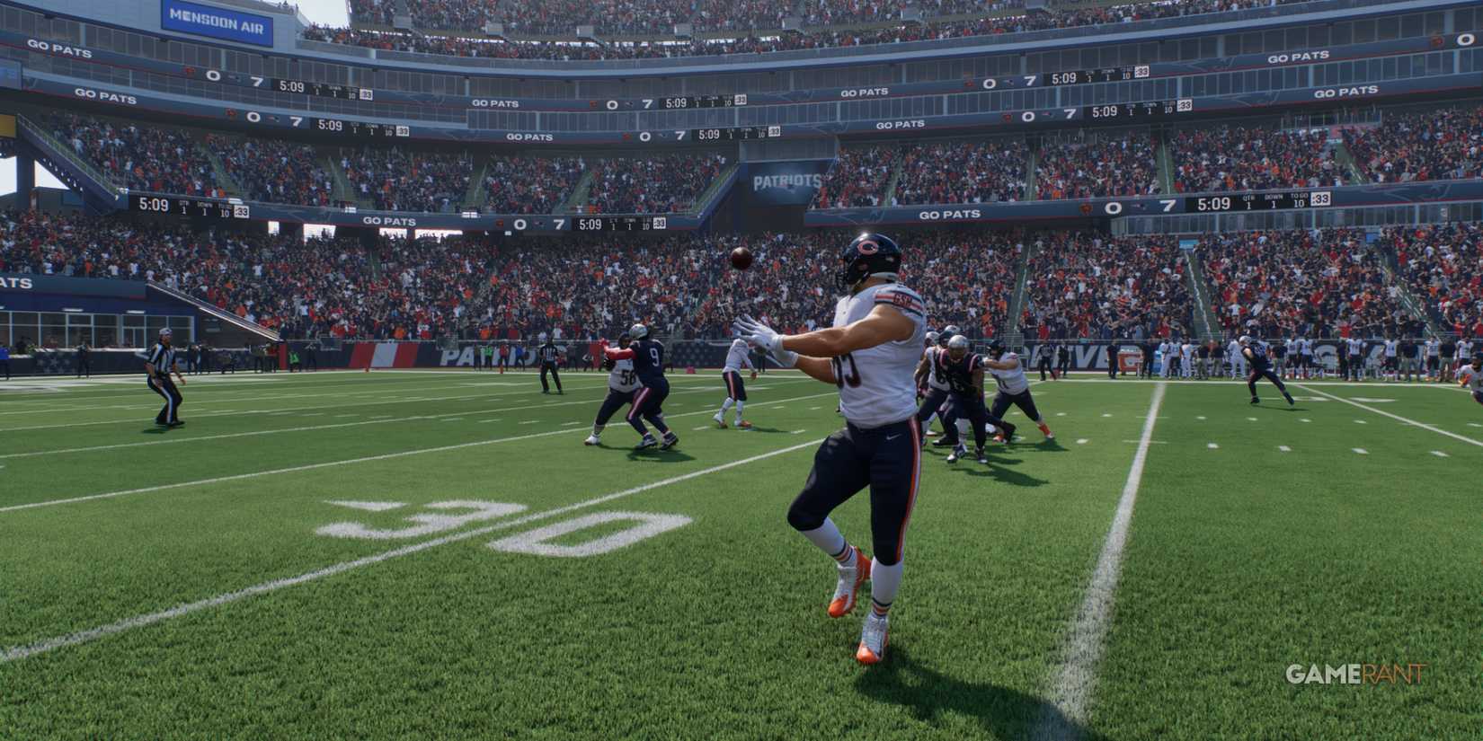 Bears TE making a crucial catch near the sideline against the Patriots in Madden NFL 25