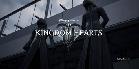 Two members of Organization XIII standing in front of a modern building with the Kingdom Hearts 3 logo in front of them.