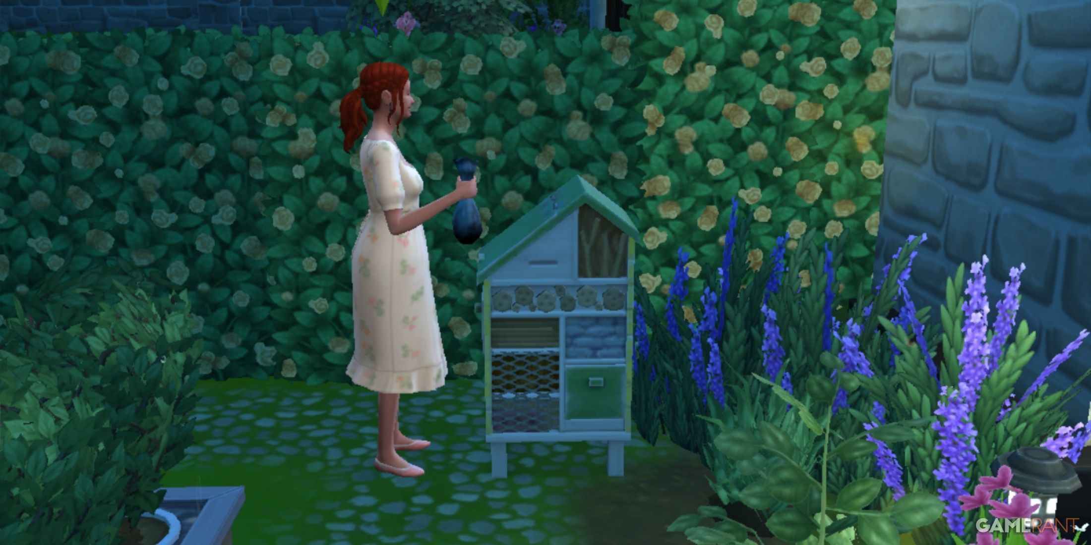 A sim is standing in front of mitey mitey's insect farm from the sims 4 eco lifestyle expansion pack