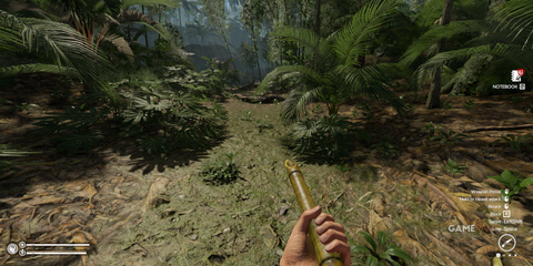 Navigating through thick undergrowth in the heart of the jungle with a crafted spear in Green Hell