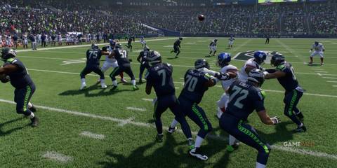 Seahawks QB Smith in the pocket, ready to release the ball under pressure in Madden NFL 25