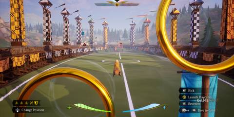 Keeper passing through rings in Quidditch Champions, detailed field in the background