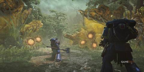 7 Linear Games That Feel Like an Open World Titus and another Space Marine stand before an alien jungle
