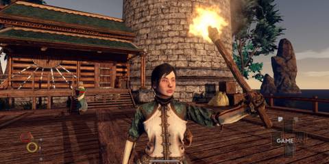 Outward player stands outside lighthouse with a torch