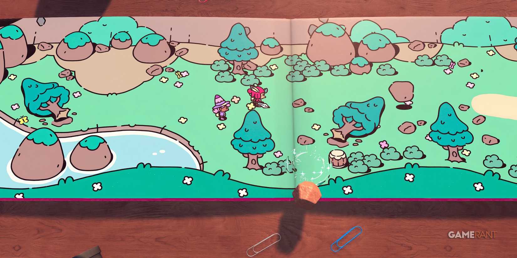 the plucky squire rockfall green grass mountains cut trees heroes