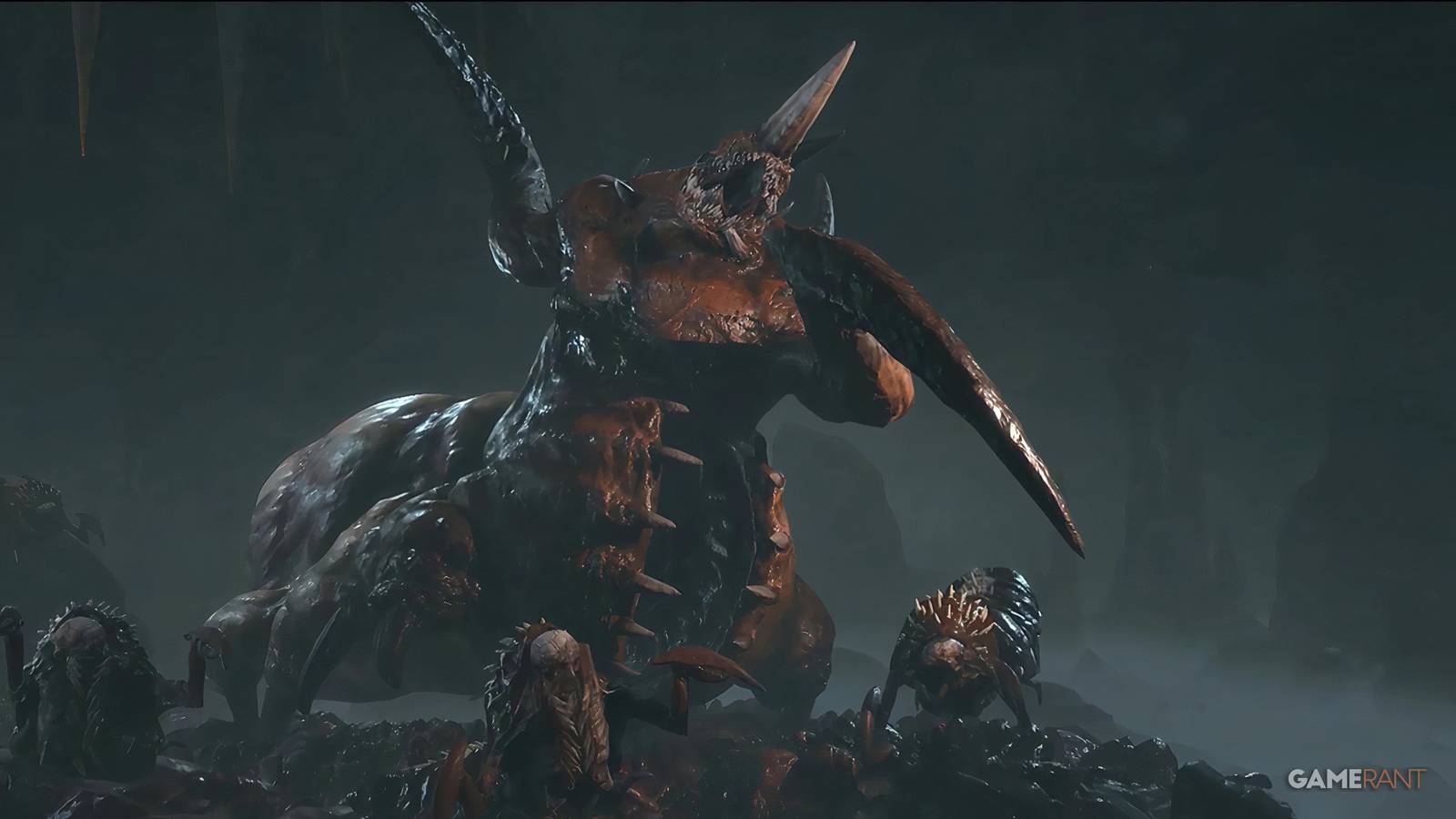 A view of Duriel from Diablo 4, ready to attack, with several maggots at his feet