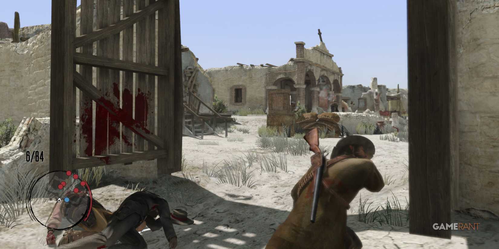 John Marston preparing for a fight at the entrance of an abandoned fort in Red Dead Redemption