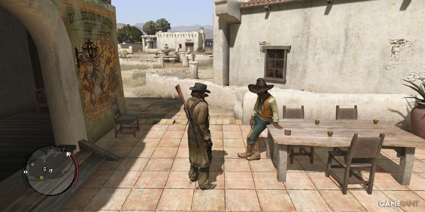 John Marston standing beside a man in a Mexican town square in Red Dead Redemption