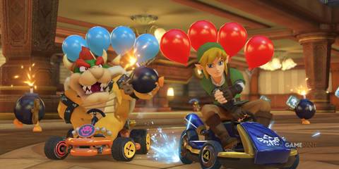 two character drivers in the video game Mario Kart 8 Deluxe with ballons at the back. 