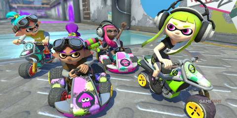 four characters in the video game Mario Kart 8 Deluxe are driving with a challenging look on their faces. 