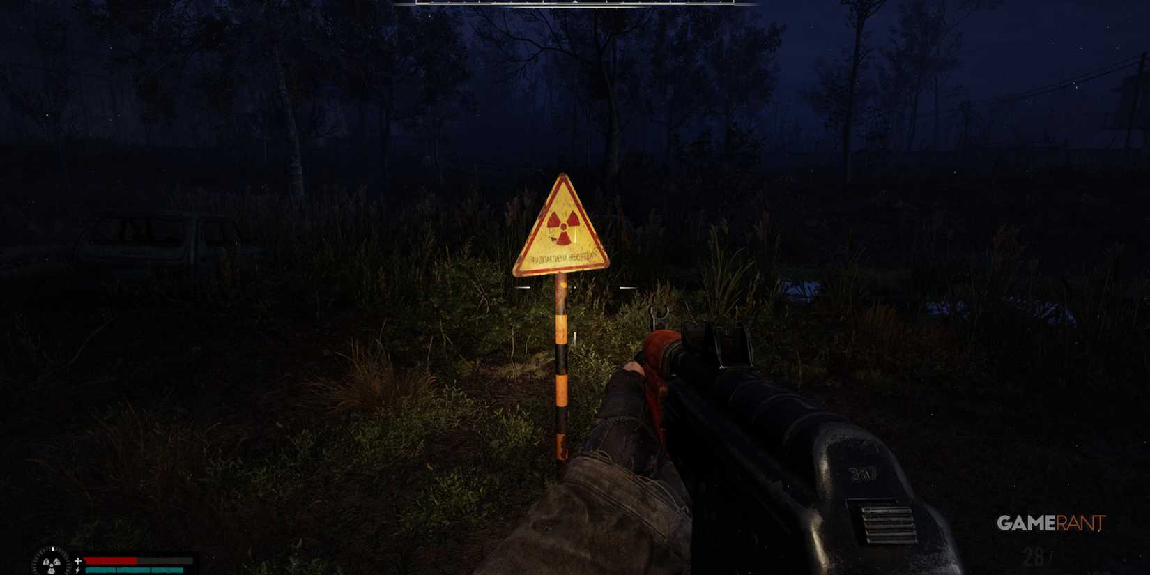 A radiation warning sign illuminated by a flashlight at night, with a rifle in view in STALKER 2