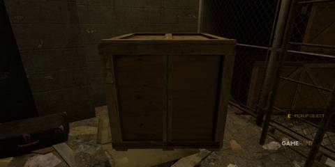 A wooden crate in a dimly lit storage area in Half-Life 2