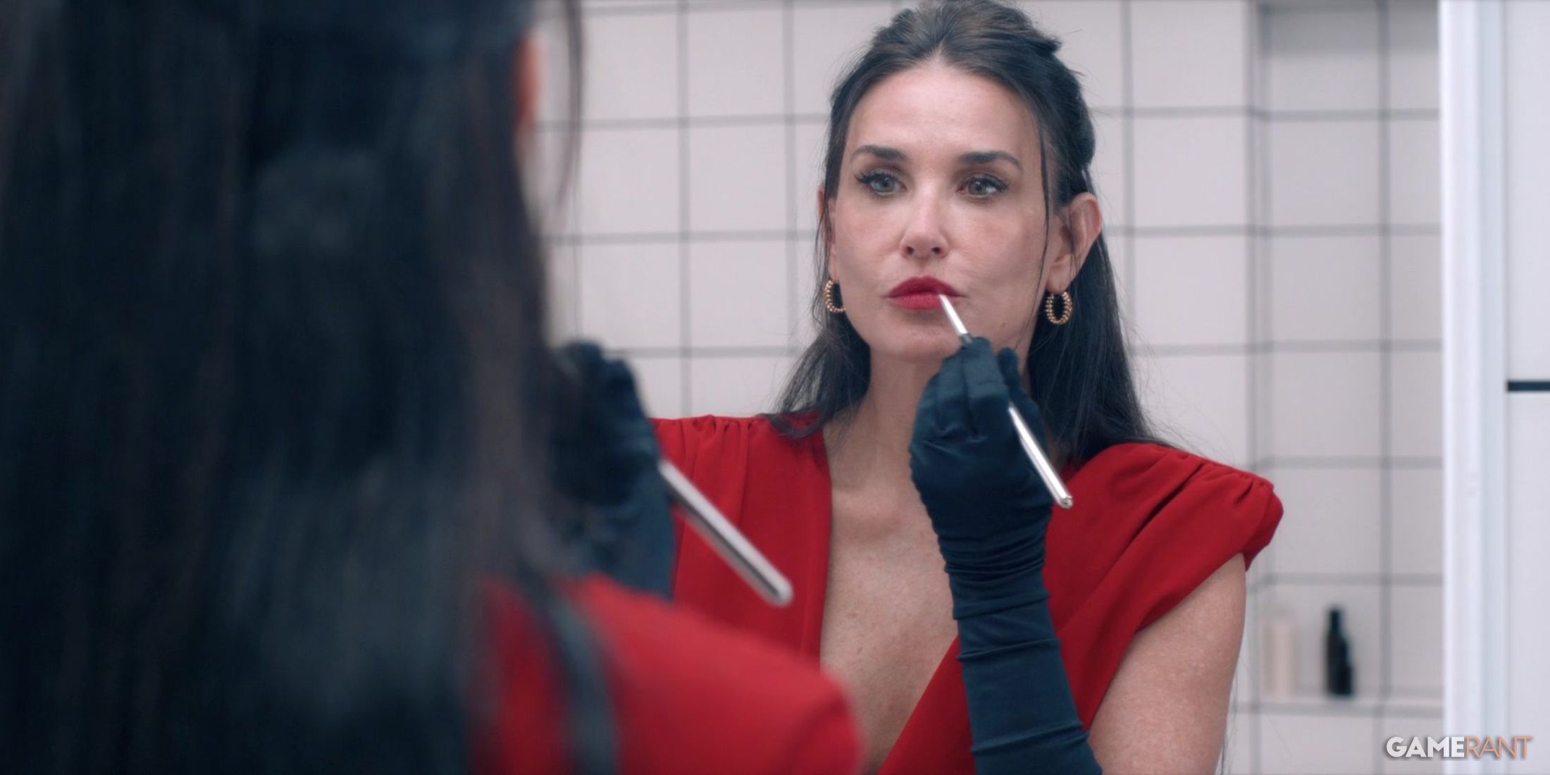 Demi Moore in The Substance looking at herself in the movie