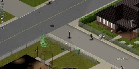 Residential street in Muldraugh, Project Zomboid, with houses, fences, and zombies roaming