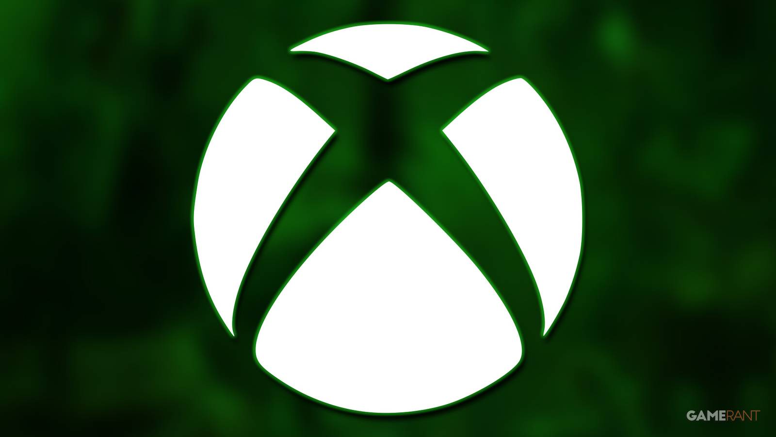 white Xbox logo submark over green-tinted and blurred LEGO Horizon Adventures promo gameplay screenshot