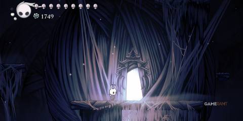 Hollow Knight: 10 Tips To Make The Game Easier The Knight stands outside the main building of distant village