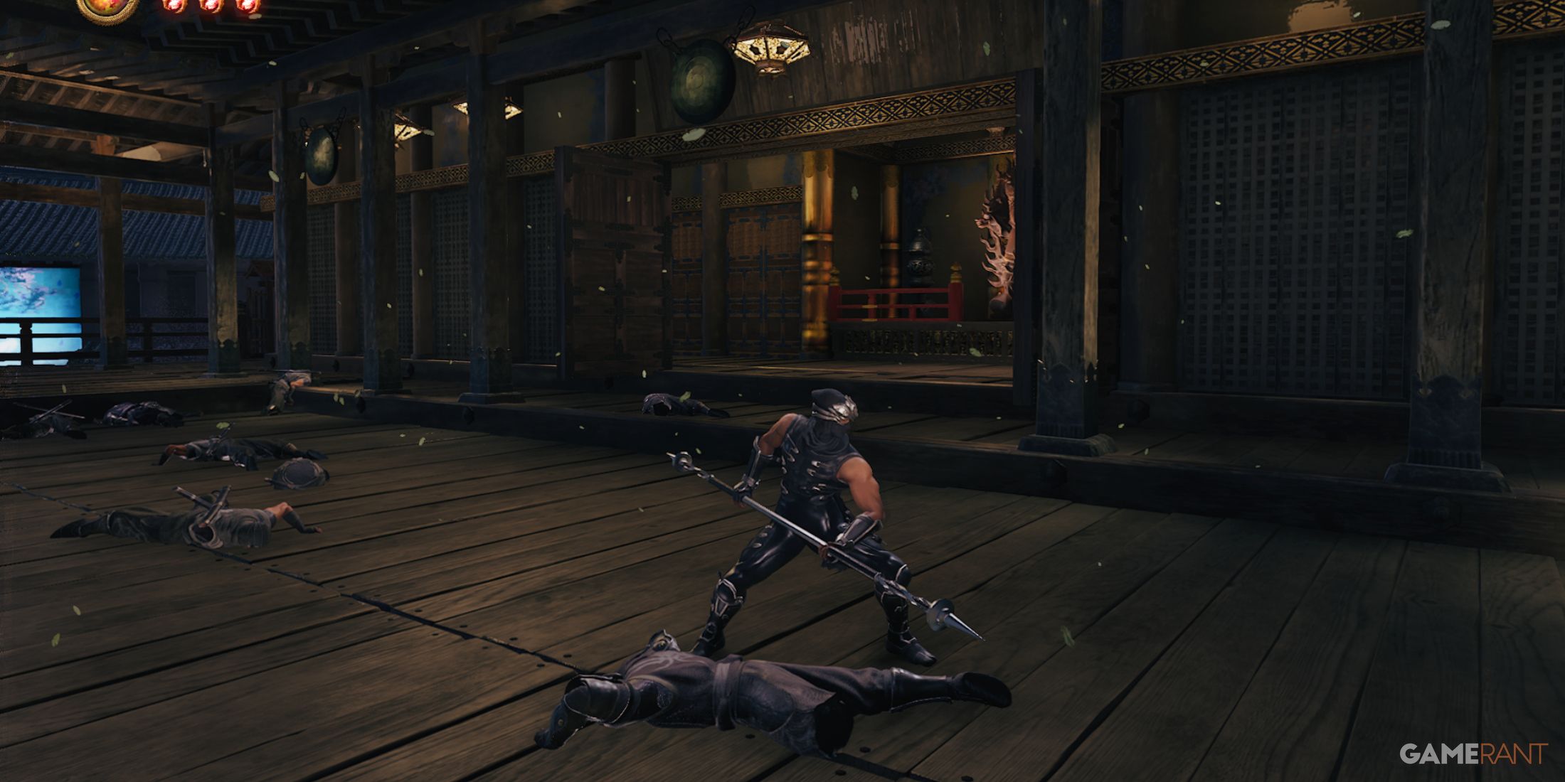 Post-battle scene with fallen enemies and Ryu standing strong in Ninja Gaiden 2 Black