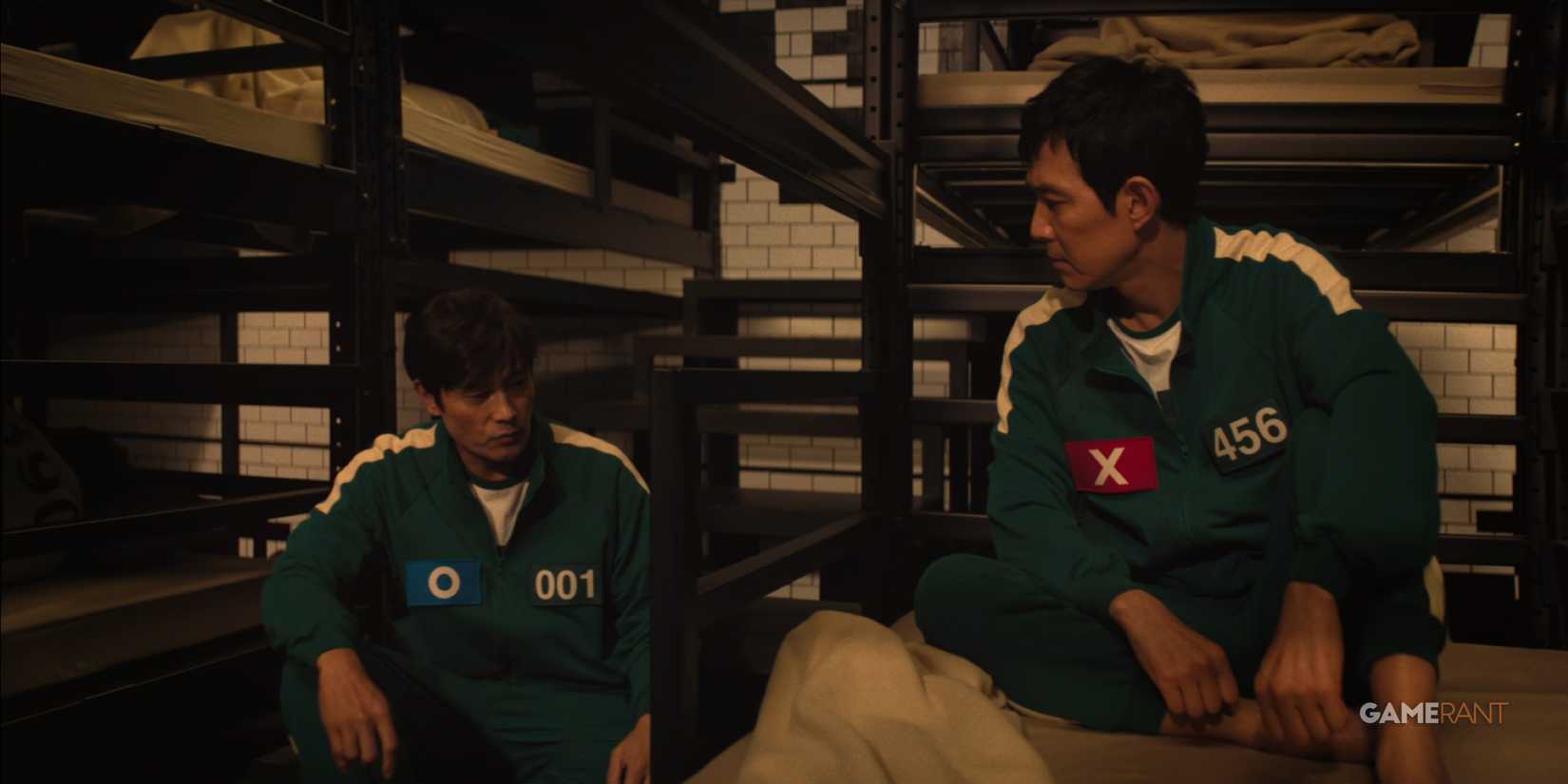 Young-il and Gi-hun chat before lights out in Squid Game.